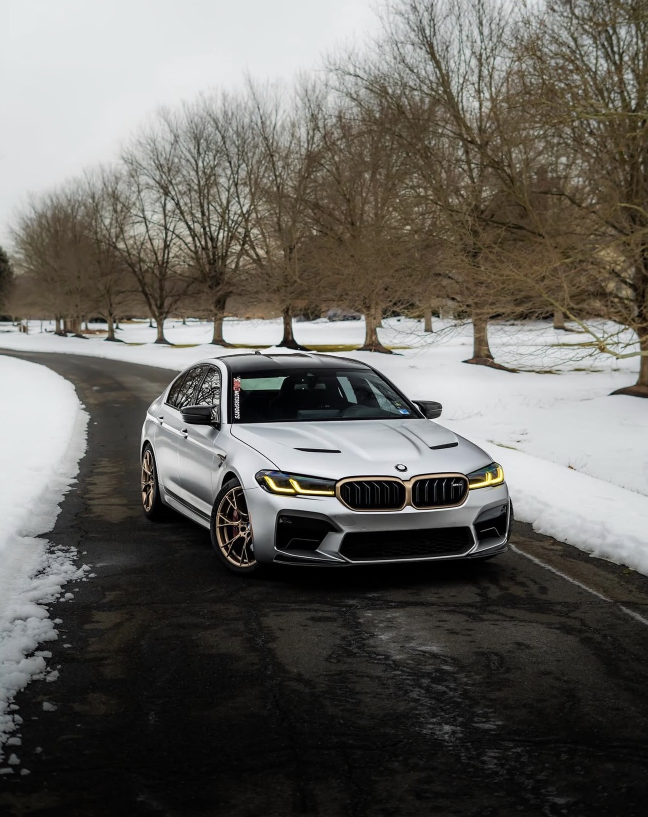 Silver BMW from CarSnipe’s past vehicle collection on a snowy driveway
